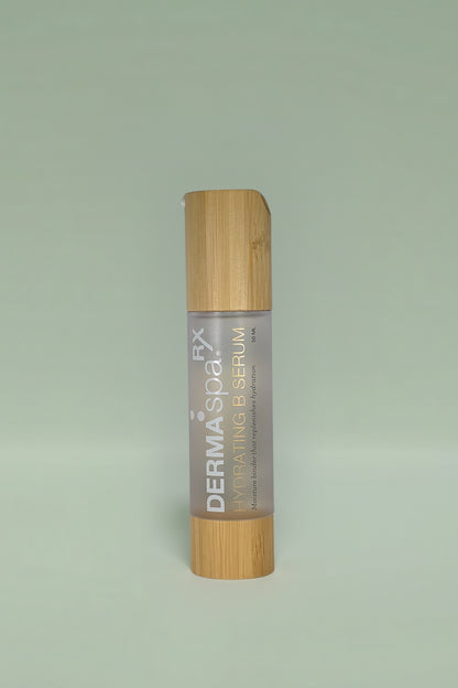 Dermaspa Rx Hydrating B Serum with bamboo cap on a light green background